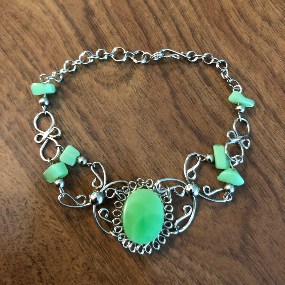 Bracelet with jade colored jewelry